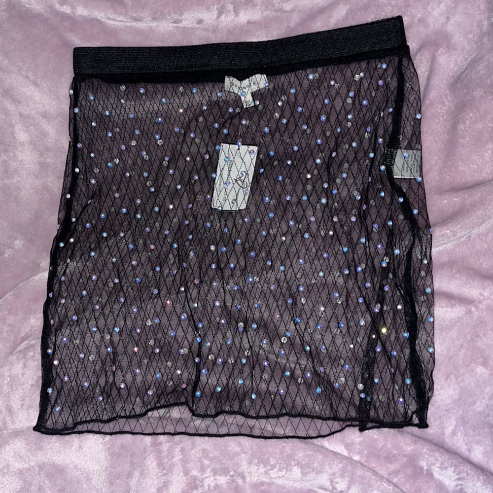 Sheer skirt with rhinestones.